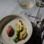 Fisch-Confit auf Polenta mit Passionsfruchtsauce und Acai-Sorbet© ALBA Communications / Christopher Hanschitz