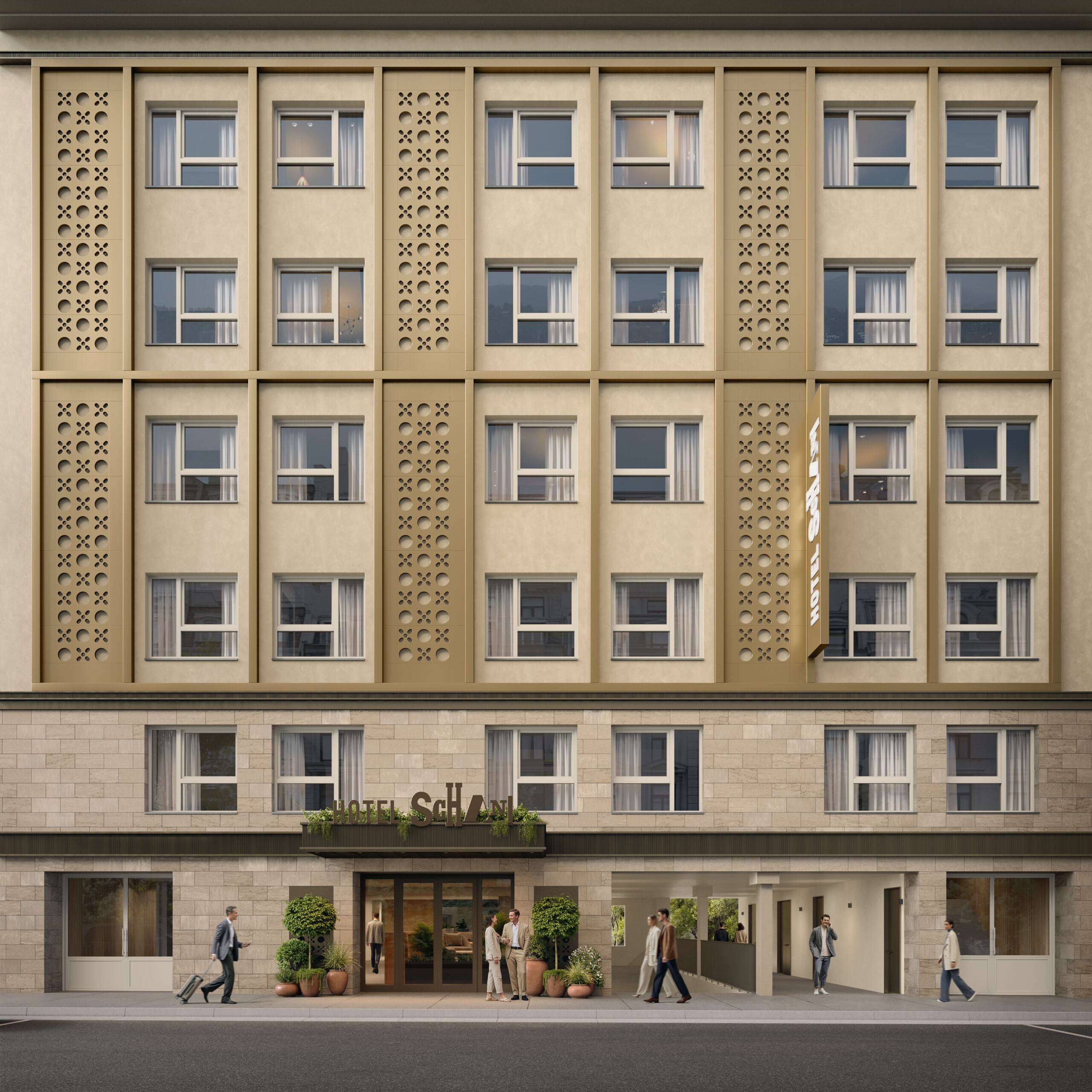 Die Fassade des Hotels ist beige mit Zierelementen.